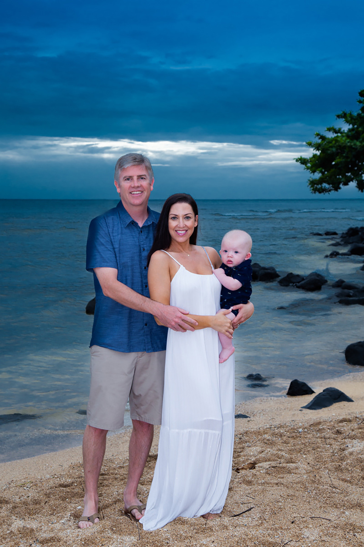 Mom dad and infant son sunset beach Kauai 